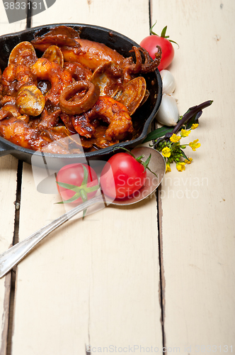 Image of fresh seafoos stew on an iron skillet