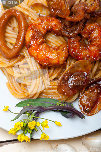 Image of Italian seafood spaghetti pasta on red tomato sauce 