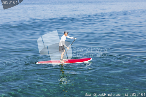 Image of Senior man practicing paddle