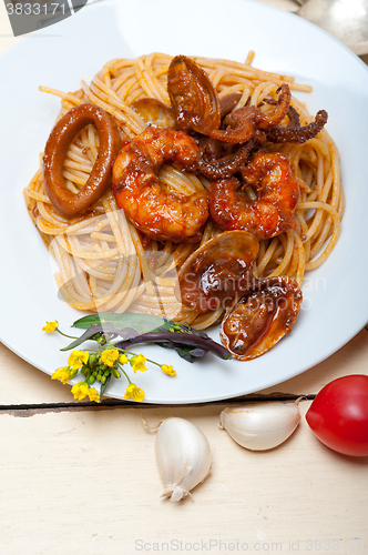 Image of Italian seafood spaghetti pasta on red tomato sauce 