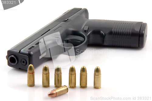 Image of row bullets and gun