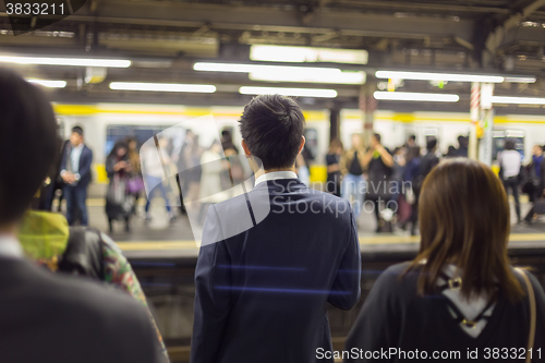 Image of Passengers traveling by Tokyo metro.