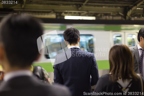 Image of Passengers traveling by Tokyo metro.