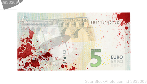 Image of Close-up of a 5 euro bank note, stained with blood