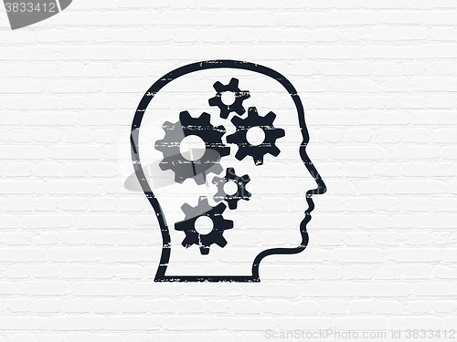Image of Data concept: Head With Gears on wall background