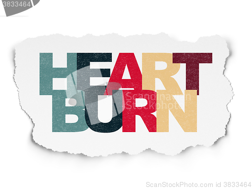 Image of Healthcare concept: Heartburn on Torn Paper background