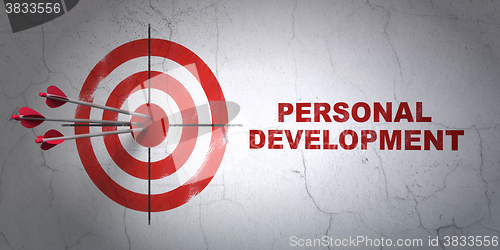 Image of Learning concept: target and Personal Development on wall background