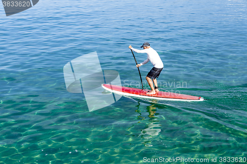 Image of Senior man practicing paddle