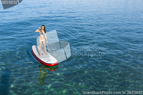 Image of Woman practicing paddle