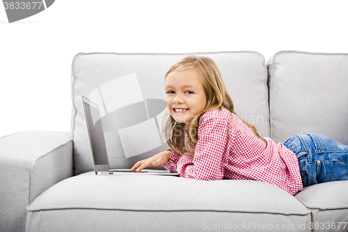 Image of Little girl working with a laptop
