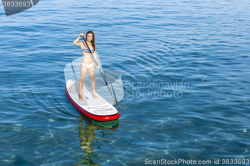 Image of Woman practicing paddle