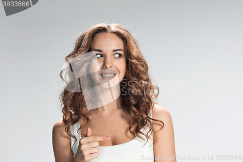 Image of The happy woman on gray background