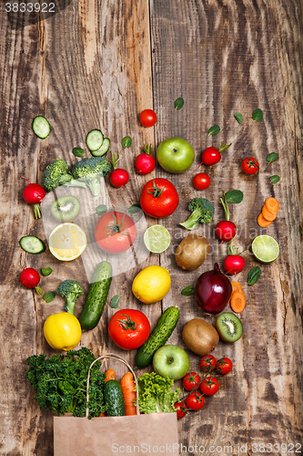 Image of The vegetables from a paper bag on wooden table