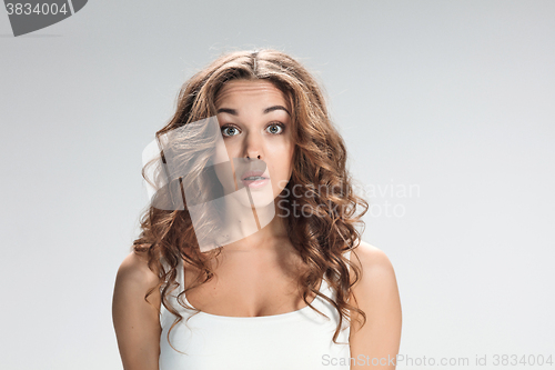 Image of Portrait of young woman with shocked facial expression