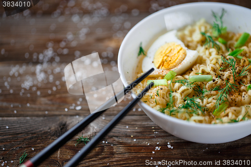 Image of Asian noodles with fresh green onion and boiled egg