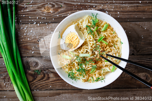 Image of Asian noodles with fresh green onion and boiled egg