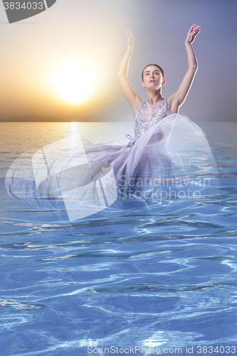 Image of The collage of a woman coming out from the sea at sunset