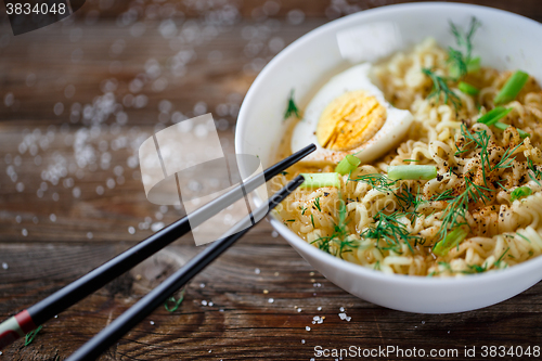 Image of Asian noodles with fresh green onion and boiled egg