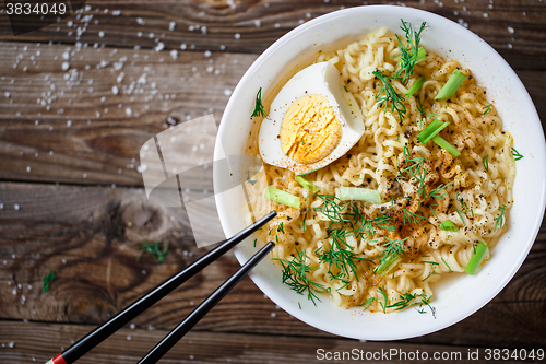 Image of Asian noodles with fresh green onion and boiled egg