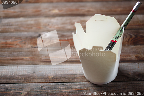 Image of Blank Chinese food container on old wood table