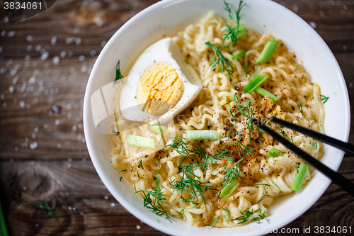 Image of Asian noodles with fresh green onion and boiled egg