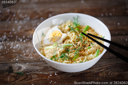 Image of Asian noodles with fresh green onion and boiled egg