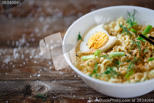 Image of Asian noodles with fresh green onion and boiled egg