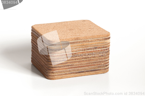 Image of Pile of cork textured coasters isolated