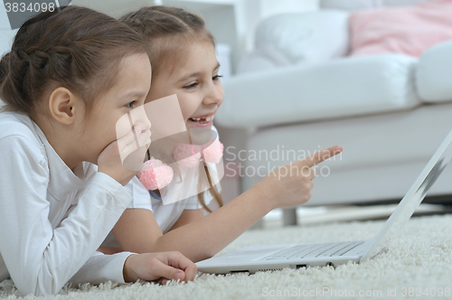 Image of little girls looking at laptop