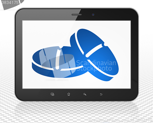Image of Healthcare concept: Tablet Pc Computer with Pills on display