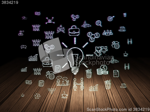 Image of Business concept: Light Bulb in grunge dark room