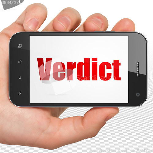 Image of Law concept: Hand Holding Smartphone with Verdict on display