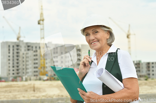 Image of senior  woman  in under construction