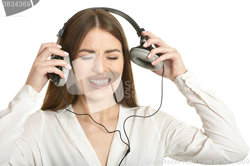 Image of Girl listening  music in headphones.