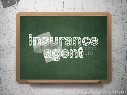 Image of Insurance concept: Insurance Agent on chalkboard background