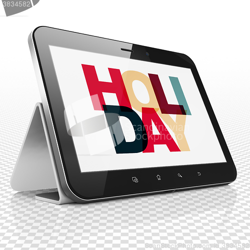 Image of Vacation concept: Tablet Computer with Holiday on  display