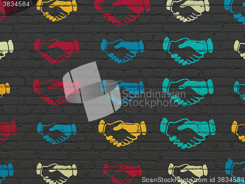 Image of Political concept: Handshake icons on wall background