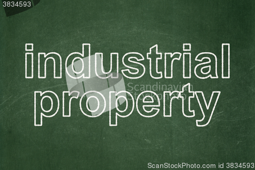 Image of Law concept: Industrial Property on chalkboard background