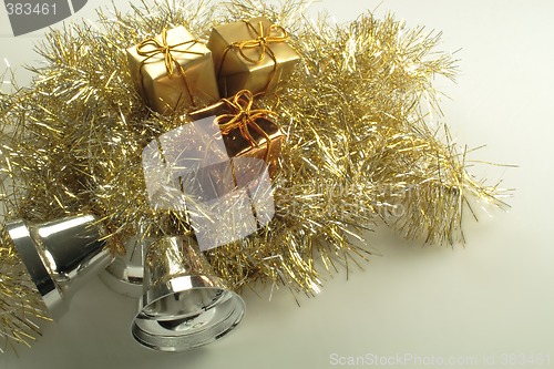 Image of gold present box decorations with golden tinsel