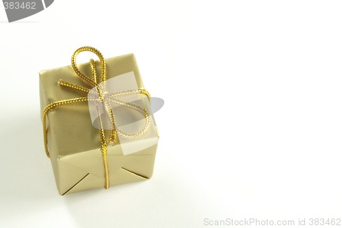 Image of small present tied with gold string
