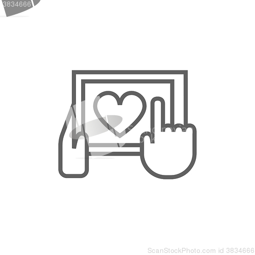 Image of Hands holding tablet with heart sign line icon.