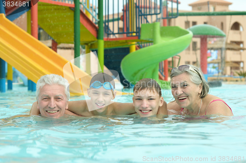 Image of Grandparents with grandchildren in pool