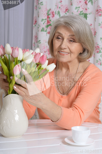 Image of mature woman drinking tea