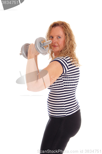 Image of Woman workout with dumbbells.