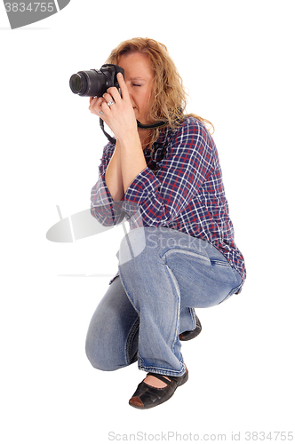 Image of Woman taking pictures.