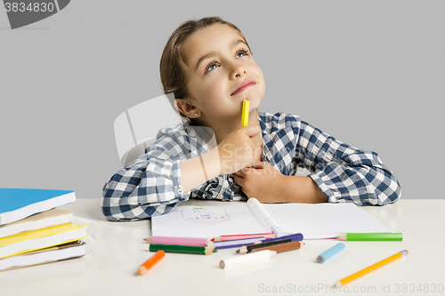 Image of Little girl making drawings