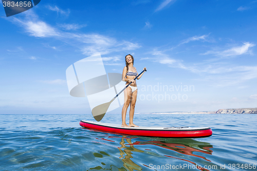 Image of Woman practicing paddle