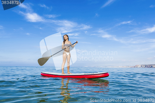 Image of Woman practicing paddle