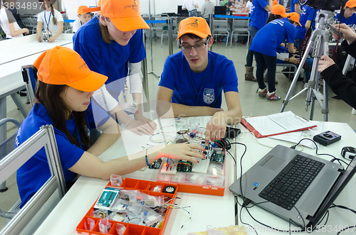 Image of students of college show electronic components