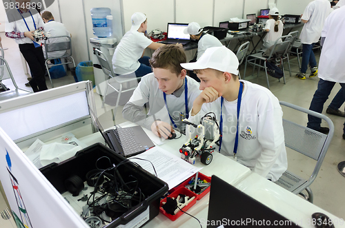 Image of School students program the robot. Tyumen. Russia